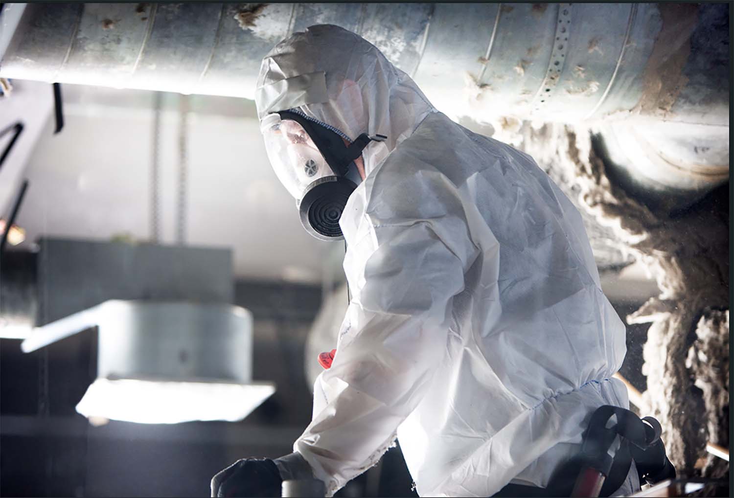 Ocab-personal med Asbestutrustning och mask